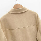 Casaco com Detalhes Vazados – Sofisticação Atemporal e Design Autoral