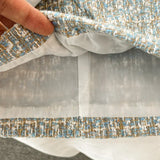 ConjuntoTweed Xadrez – Blazer Manga Longa + Saia A-Line Assimétrica